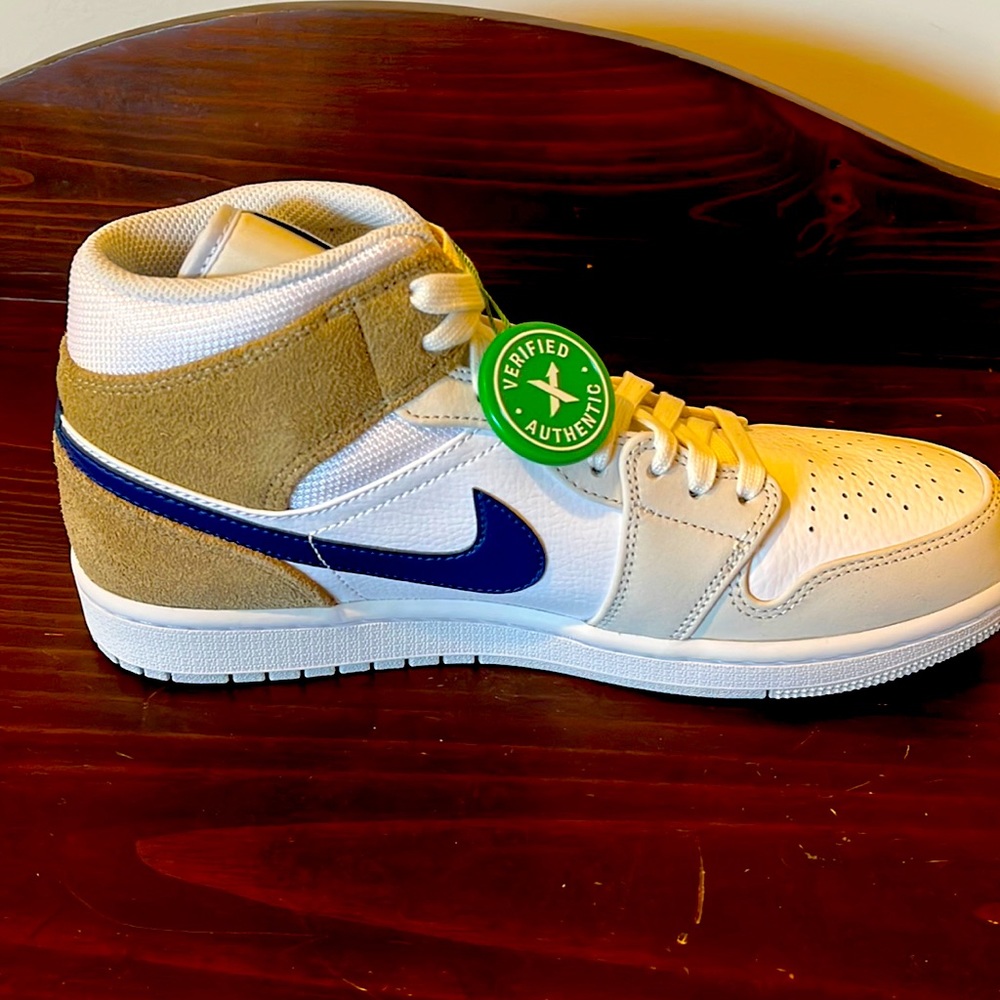 New Jordan’s mens size 8.5; white sneaker, navy swoosh, tan accent, purple stamp
